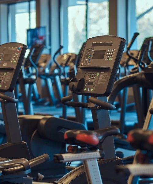 Interior of fitness hall with fitness bicycles.